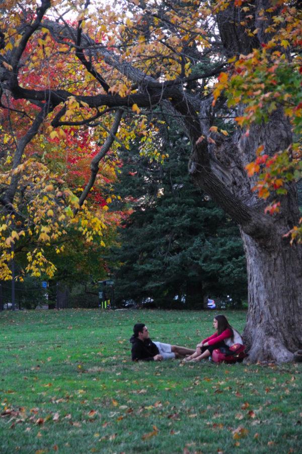 Iowa State students relax on Central Campus on a cool fall day. 