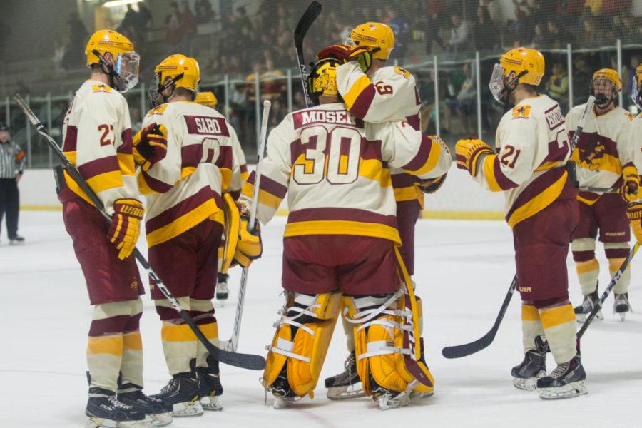 Members of the Cyclone Hockey team celebrate after the third period Oct. 6. The Cyclones defeated Oklahoma 3-1.