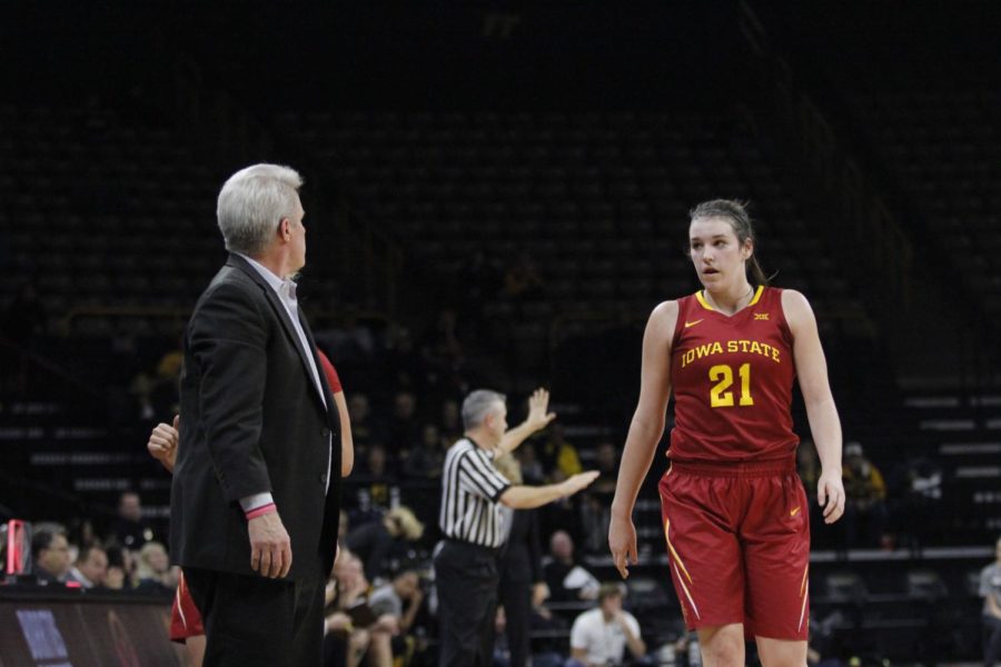 Coach Bill Fennelly talks to sophomore guard Bridget Carleton after she fouls out of the game in the later part of the fourth quarter. Iowa State couldnt defend the Cy-Hawk basketball title as it fell 88-76 to Iowa on Dec. 7 in Iowa City, Iowa. 