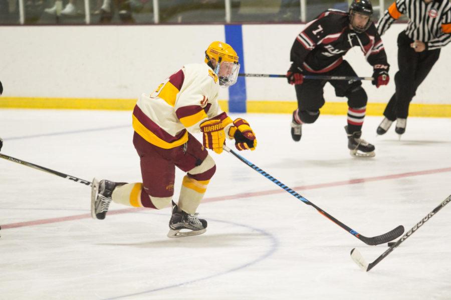 Member of the Cyclone Hockey club team takes the puck up the ice Sept. 22 during their first official game of the season against Illinois State. The cyclones won 4-1 with three of the four goals happening in the third period.