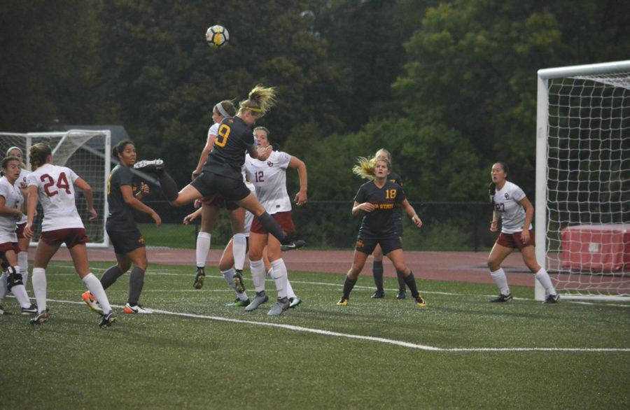 Shealyn Sullivan, defender, heads the ball during the Cyclones versus Oklahoma game at the Cyclone Sports Complex on Oct. 6. After playing in on and off rain showers the game ended 0-0 in double overtime.