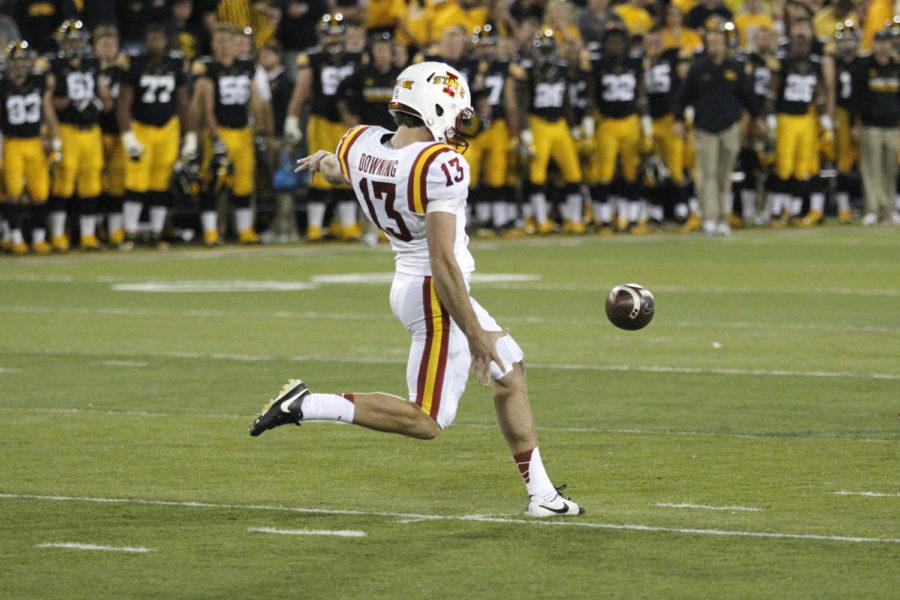 Colin Downing punts the ball away on Saturday at Kinnick Stadium in Iowa City.