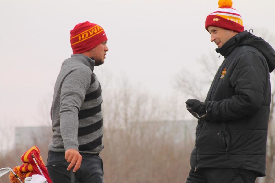 Sam Daley, junior form Wynnum, Australia gets advice from head coach Andrew Tank as the Iowa State mens golf team begins to prepare for upcoming tournaments. As the colder weather begins to subside, providing favorable conditions on the green, Tank lead the team through their first practice of the season at the Coldwater Golf Links southeast of campus.