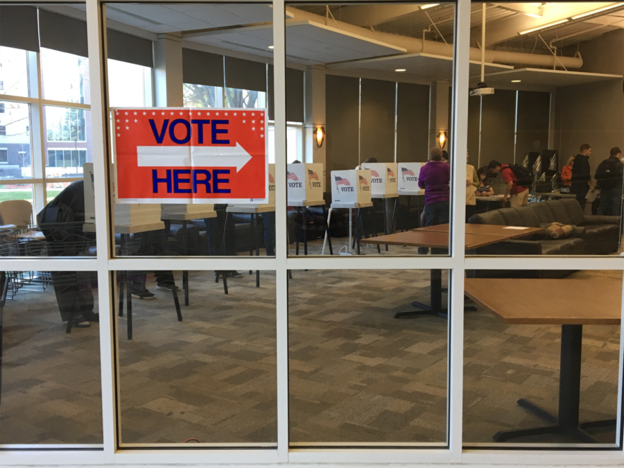 Iowa State students and Ames residents vote inside Buchanan Hall.