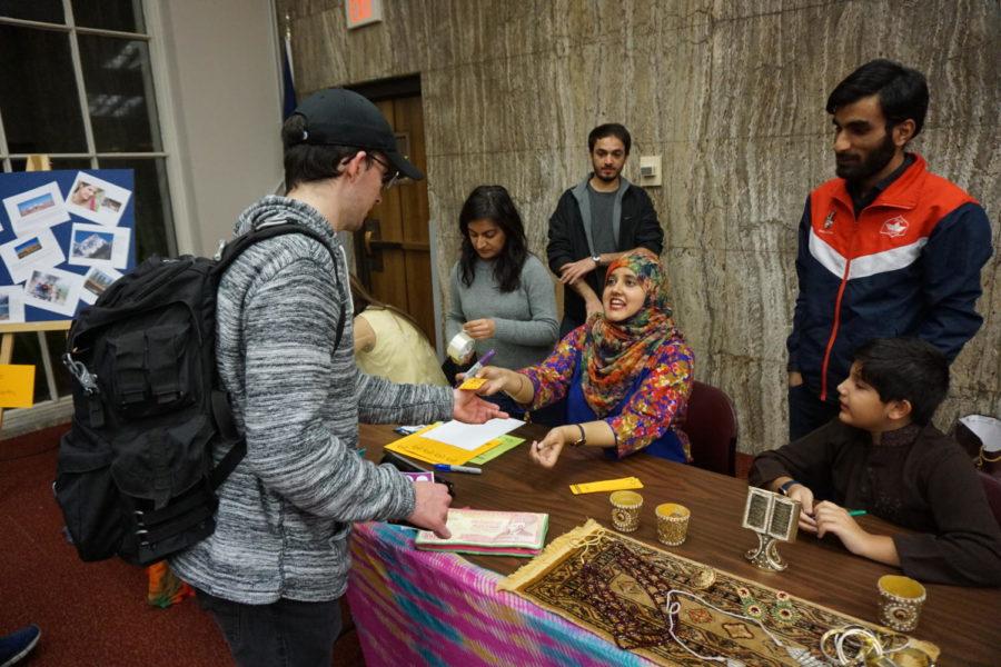 Students see how their names are written in Urdu during the International Bazaar in the Memorial Union on Oct. 25.