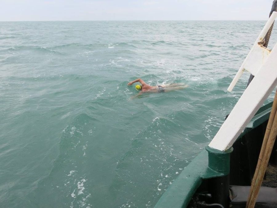 Adam Grimm, senior in horticulture, swims across the English Channel.