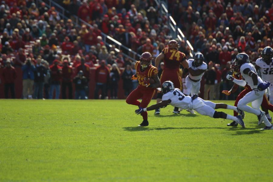 Iowa State running back David Montgomery breaks a tackle early in the game against TCU.