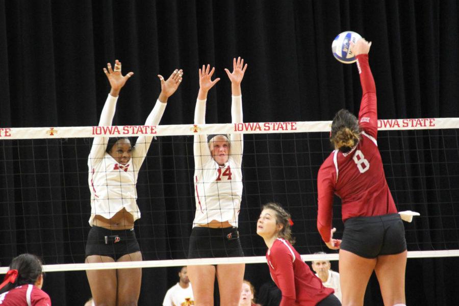 Juniors Grace Lazard and Jess Schaben blocking the ball during the Iowa State vs. Oklahoma volleyball game.
