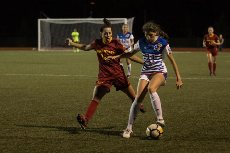Midfielder Brooke Tasker tries to steal the ball from a Kansas soccer player during the during the home opener for the Big 12 conference game on Sept. 29. The Iowa State soccer team lost 2-1.