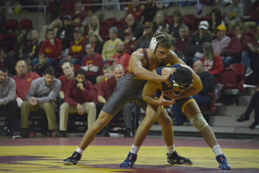 Kanen Storr of the Iowa State wrestling team faces off against Julian Flores from Drexel during the wrestling meet held at Hilton Coliseum on Nov. 12.