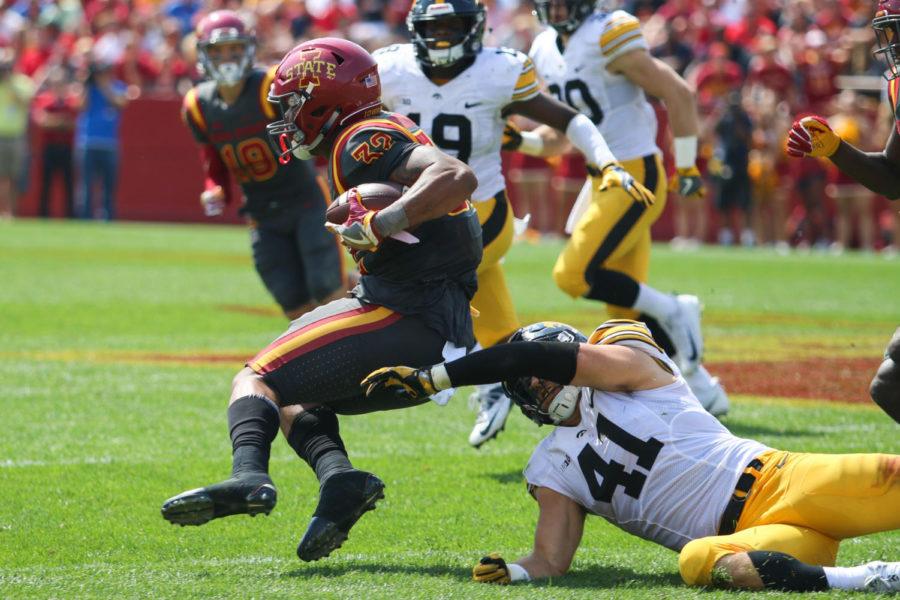 Iowa States David Montgomery breaks from a tackle by Iowas Bo Bower during the annual CyHawk football game Sept. 9, 2017. The Cyclones fell to the Hawkeyes 44-41 in one overtime.