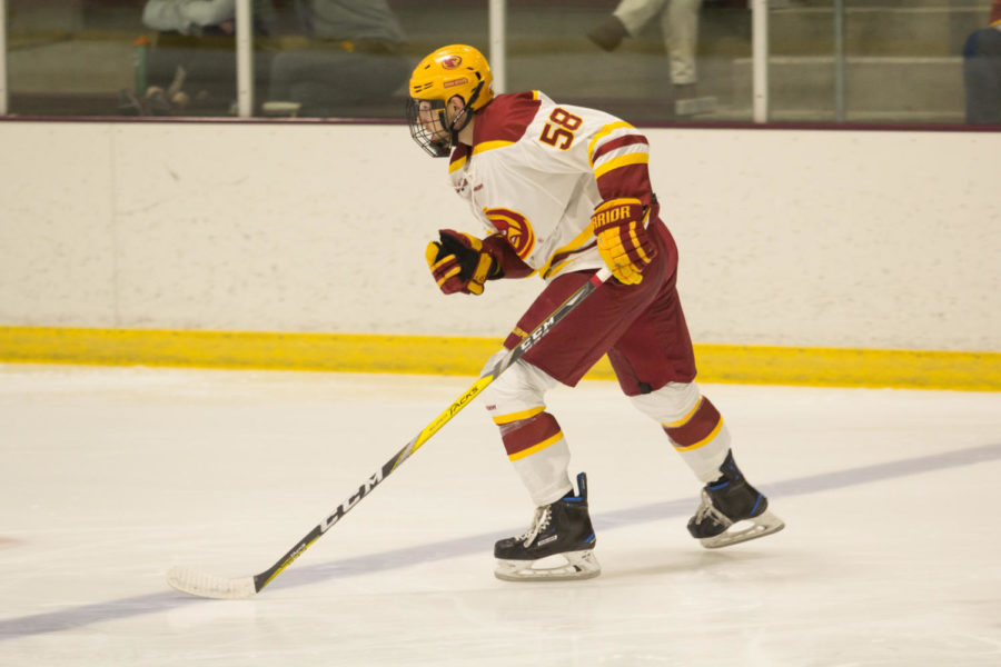 Member of the Cyclone Hockey Club Team skates down the ice during the Cardinal and Gold Team Scrimmage Sep. 15. Gold Team won over Cardinal 5-2.