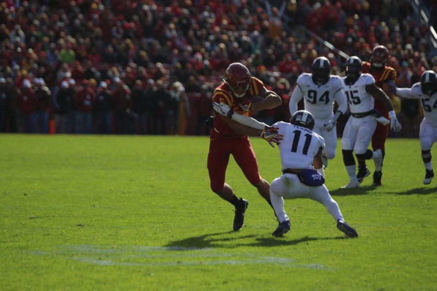 Iowa State receiver Allen Lazard shucks a defender while fighting for yards after the catch against TCU.