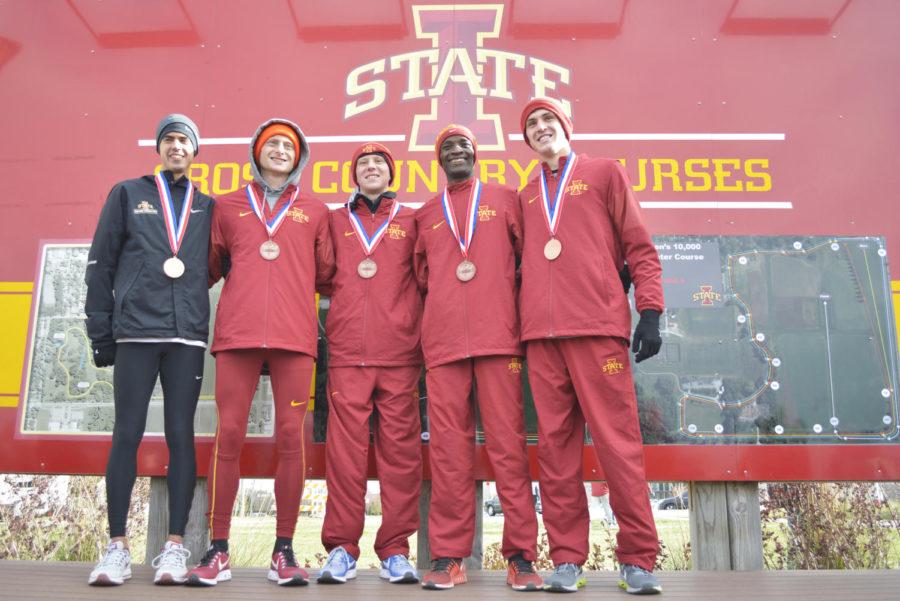 Nathan Rodriguez, Dan Curts, Andrew Jordan, Stanley Langat and Milo Greder of the Iowa State mens cross country team pose for photos after receiving medals for placing in the top 25 for the NCAA Cross Country Midwest Regional held at Iowa State on Nov. 10.