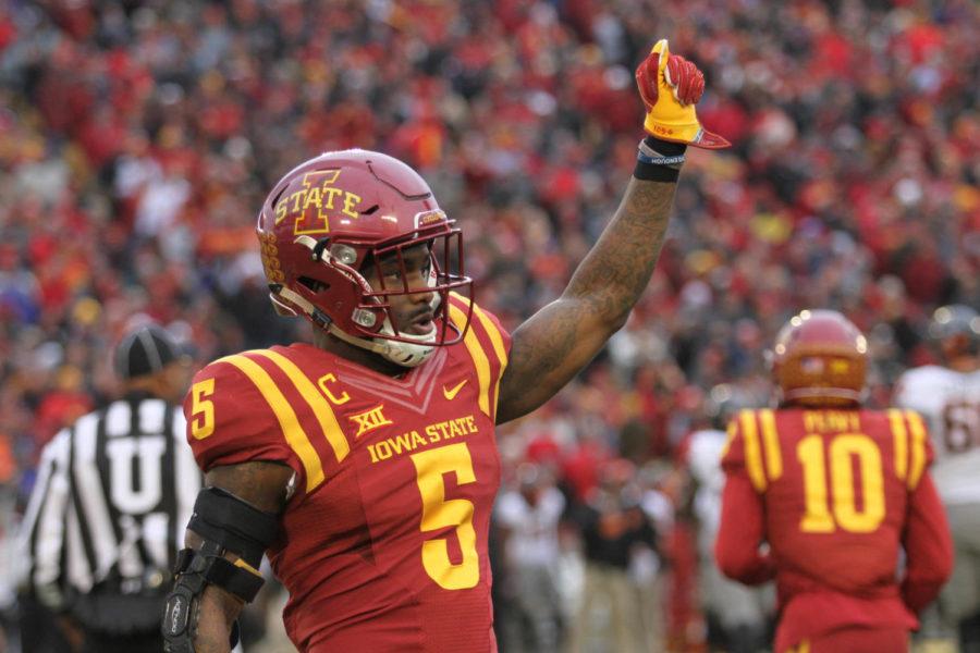 Defensive back Kamari Cotton-Moya raises his fist in a game against Oklahoma State on Nov. 11 at Jack Trice Stadium. Iowa State fell to the Cowboys, 49-42. 