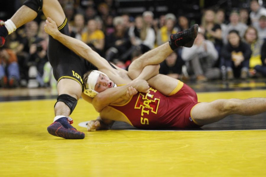 Then+redshirt+freshman+Colston+DiBlasi+gets+put+into+a+head+lock+by+the+Iowa+wrestler+in+the+157-pound+match.+DiBlasi+lost+his+match+with+an+8-7+final+score+as+Iowa+State+lost+the+Cy-Hawk+wrestling+match+to+Iowa+26-9+on+Dec.+10+in+Iowa+City%2C+Iowa.%C2%A0