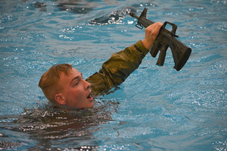 Winston+Veatch%2C+freshman%2C+tries+to+reach+one+side+of+the+pool+while+holding+a+rubber+rifle+during+the+ROTC+Combat+Water+Survival+Training+at+Beyer+Hall+on+Nov.+15.