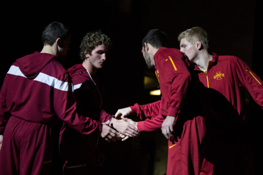 Members+of+the+Iowa+State+Wrestling+Team+shake+hands+with+members+of+the+Rider+Wrestling+Team+after+being+announced+Nov.+26+in+Stephens+Auditorium+during+the+Iowa+State+vs+Rider+wrestling+meet.+The+Cyclones+were+defeated+15-22.%C2%A0