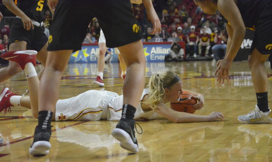 Forward Madison Wise falls during the game against University of Iowa on Dec. 6 at Hilton Coliseum. The Cyclones lost 55-61.
