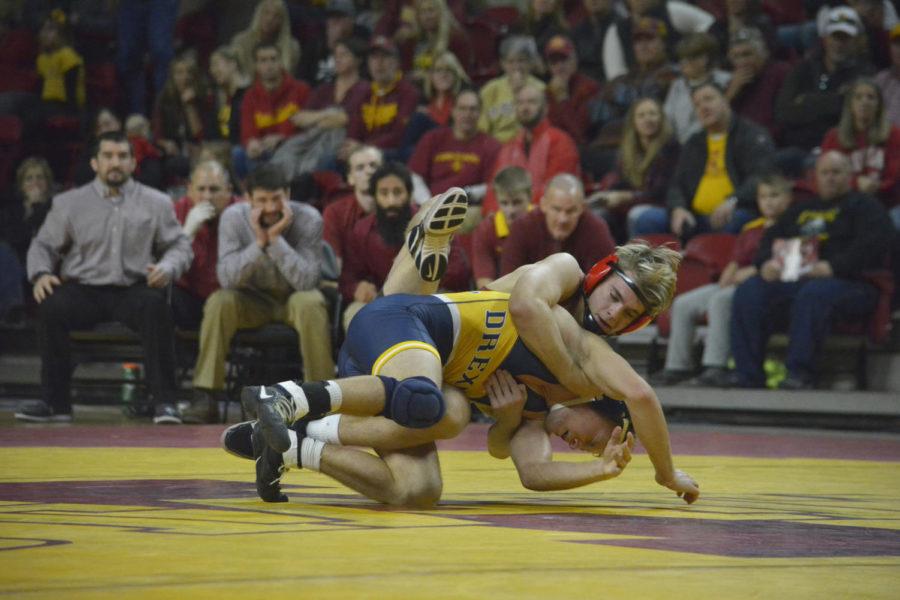 Jakob Allison of the Iowa State wrestling team faces off against Tanner Shoap from Drexel during the wrestling meet held at Hilton Coliseum on Nov. 12.