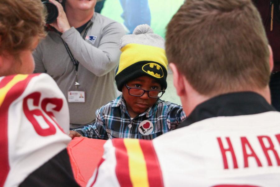 David, 4, talks to tight end Sam Harms (right) during a meet and greet at St. Jude Children's Research Hospital in Memphis, Tennessee on Dec. 28. Members from the Iowa State football team spent an hour touring and signing autographs at the hospital.