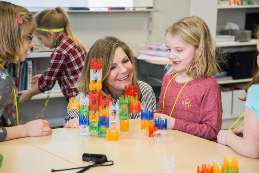 Teresa Green, a teacher at Edwards Elementary School, helps 1st grade students build a marble run in the combined library/Makers Space Jan. 23. 
