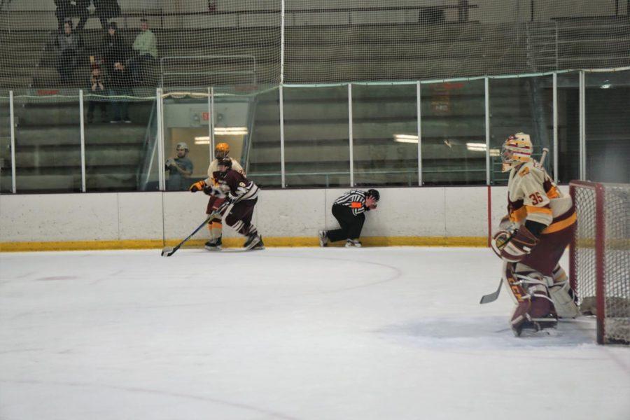 At the Iowa State VS Rob Morris hockey game on January 19th, a referee was caught in an attempted check to steal the puck.