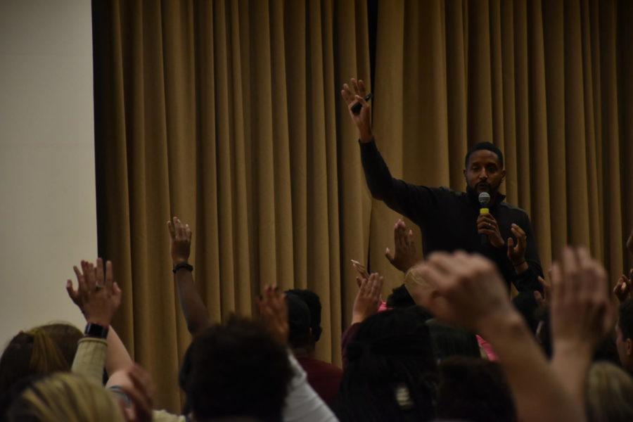 Speaker Rasheed Ali Cromwell taking a poll of Greek-Life students at his Tuesday night talk, titled All We Do is Step, Stroll, Hop + Salute?!, on Multicultural Greek-Life impact.