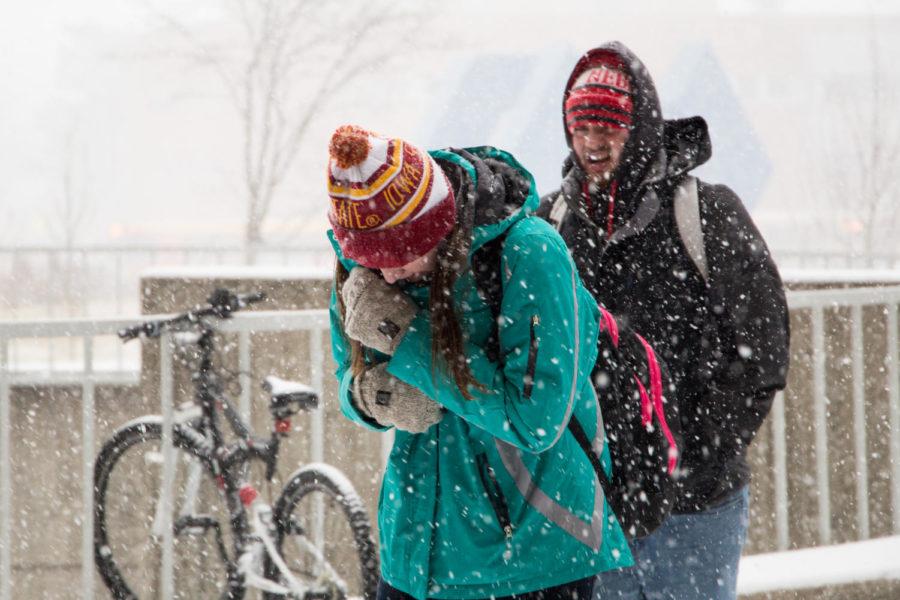 Iowa+State+students+walk+though+a+snowstorm+to+get+to+the+College+of+Design+on+Jan+11.%C2%A0Despite+a+12-hour+winter+weather+advisory+the+university+remained+open.