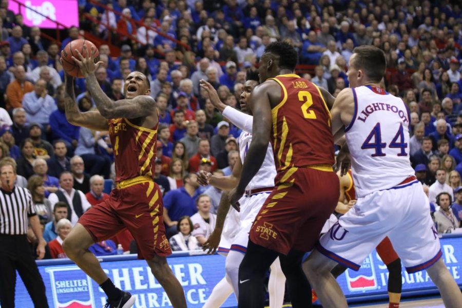Iowa+State+senior+Donovan+Jackson+takes+a+shot+after+contact+from+a+Kansas+defender+during+the+first+half+in+Allen+Fieldhouse.+Jackson+put+up+8+points+in+the+first+half+of+play.