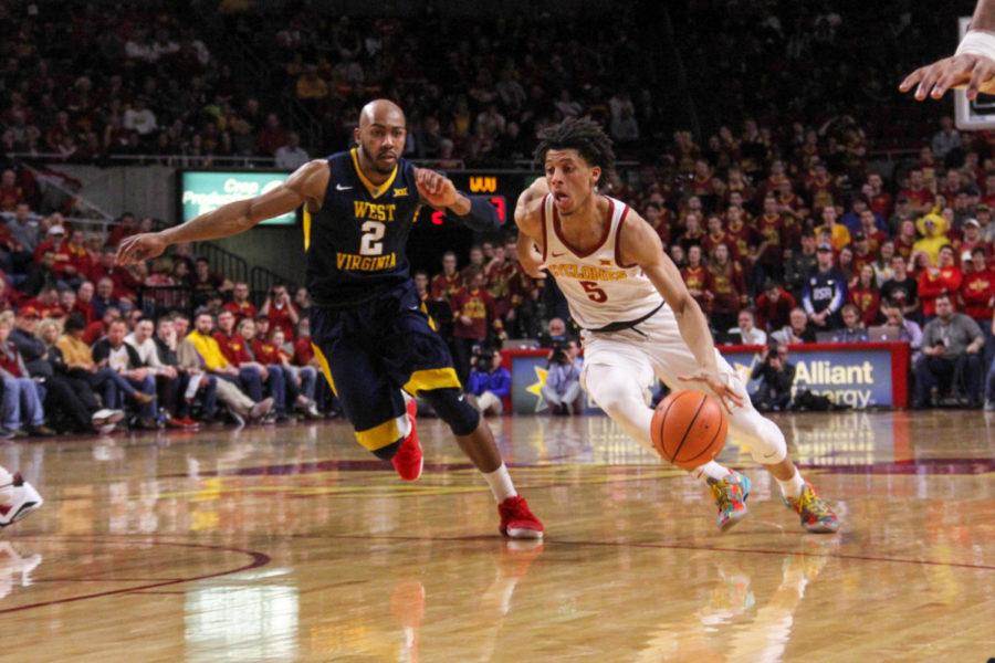 Freshman+Lindell+Wigginton+dribbling+down+the+court+during+the+game+against+West+Virginia+University+at+the+Hilton+Coliseum+on+Jan.+31.