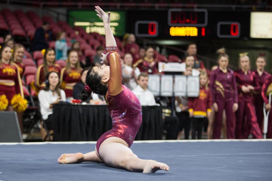 Members of the Iowa State gymnastics team compete during the first home meet of the season against Arizona Jan. 12 in Hilton Coliseum. The Cyclones defeated the Wildcats 195.45 to 194.975.
