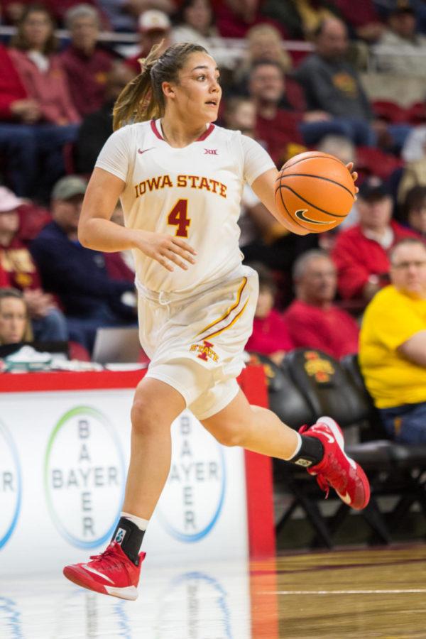Freshman guard Rae Johnson dribbles down the court during the game against UC Riverside Dec 17. The Cyclones defeated Riverside 89-66.