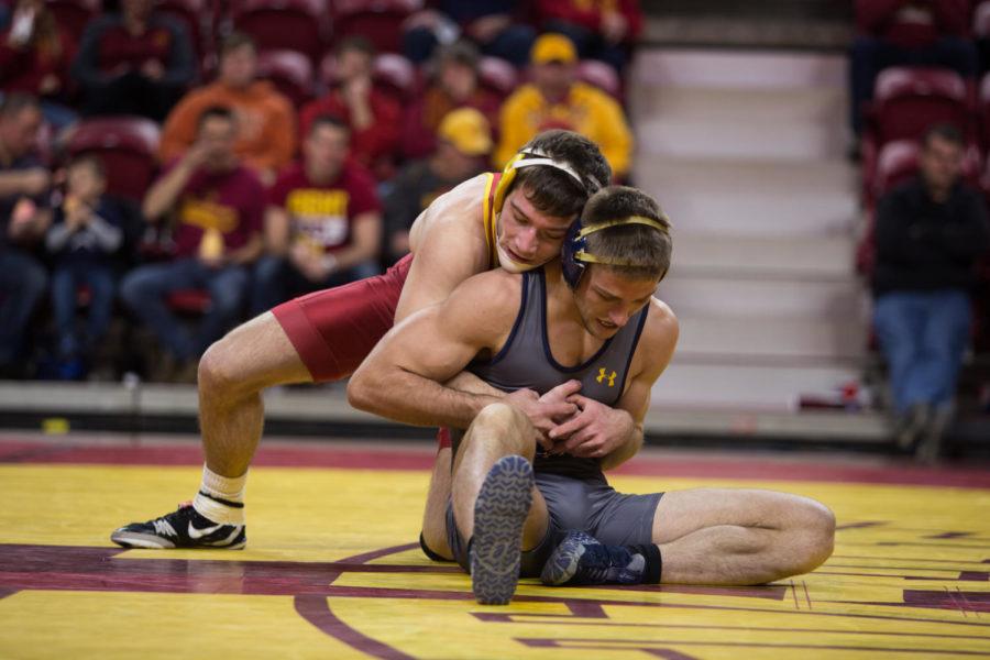 Redshirt Sophomore Chase Straw wrestles against Northern Colorado wrestler Tyler Kinn Jan. 5 in Hilton Coliseum.  The cyclones were narrowly defeated by the UNC Bears 20-22. 