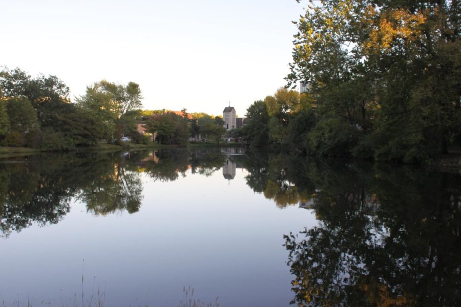 Lake LaVerne shows the refection of St. Thomas Aquinas Church &amp; Catholic Student Center