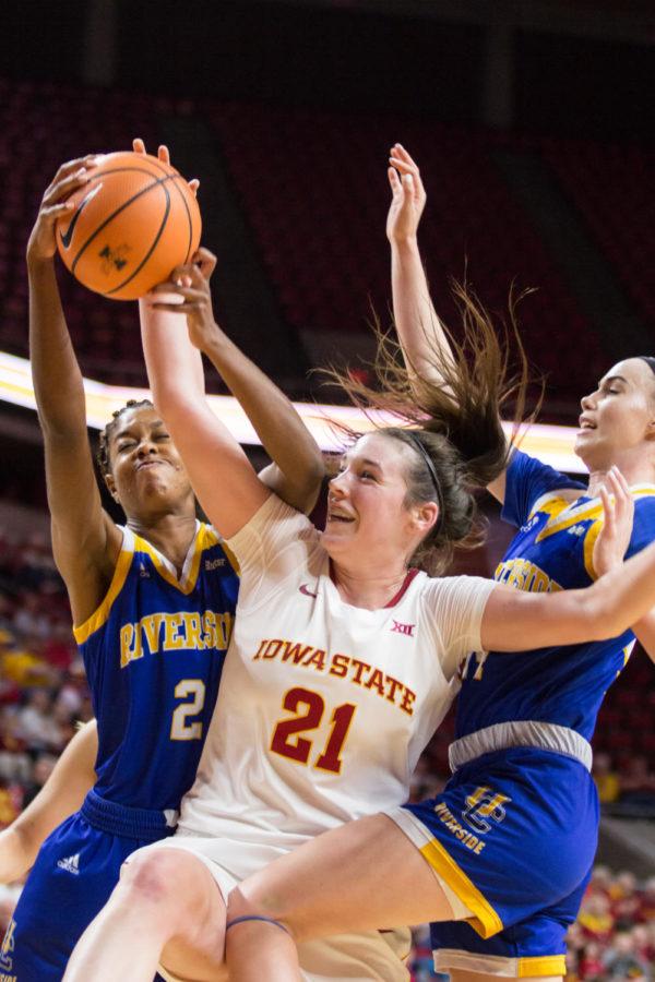 Junior guard Bridget Carleton goes up for a rebound during their game agaisnt UC Riverside Dec 17. The Cyclones defeated Riverside 89-66.