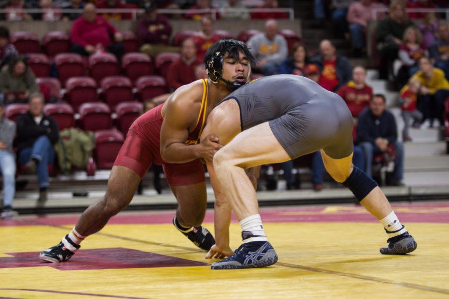 Redshirt Senior Dane Pestano wrestles against Northern Colorado wrestler Dylan Gabel Jan. 5 in Hilton Coliseum.  The cyclones were narrowly defeated by the UNC Bears 20-22. 