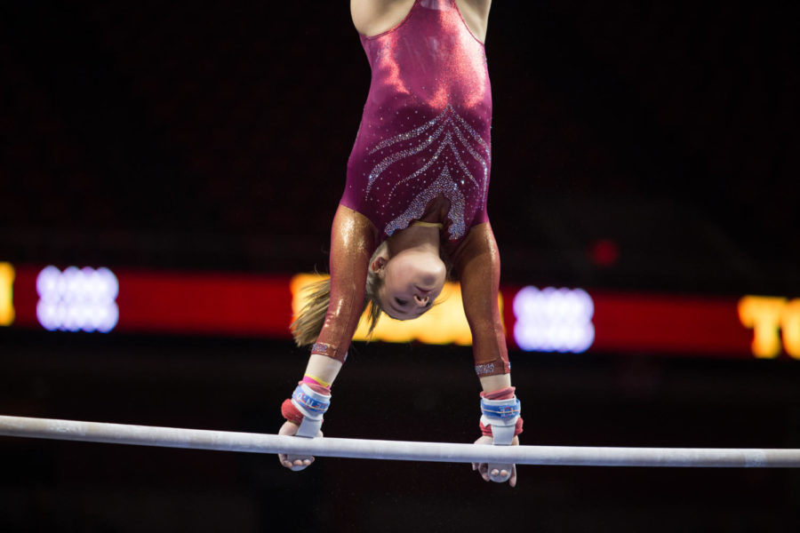 Iowa State senior Kelsey Paz competes on the uneven bars during the first home meet of the season against Arizona Jan. 12 in Hilton Coliseum. The Cyclones defeated the Wildcats 195.45 to 194.975.