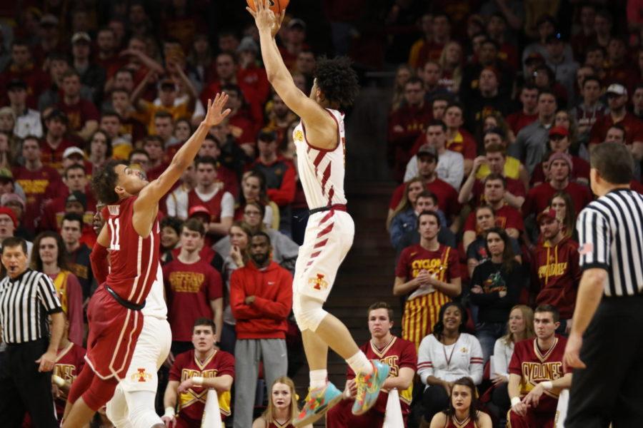 Iowa State freshman Lindell Wigginton takes a shot over Oklahomas Trae Young during the second half on Feb. 10. Young, the nations leading scorer, praised Wiggintons play after the game.