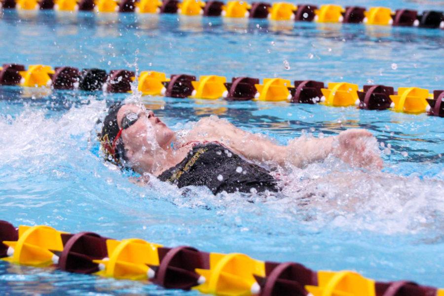 An Iowa State swimmer swimming the 100 meter backstroke during their duel meet against the University of Kansas on Feb. 2 at Beyer Hall.
