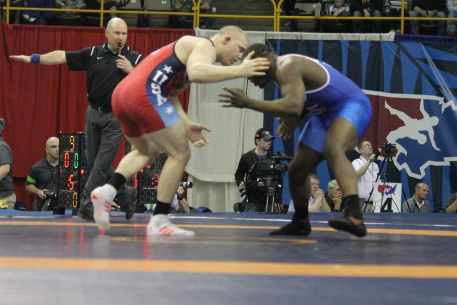 Former Iowa State wrestlers Jake Varner (red) and Kyven Gadson (blue) square off in the semifinals of the Olympic Trials on April 10 in Iowa City, Iowa. Varner won the match, but later lost to Ohio States Kyle Snyder in the championship round. 