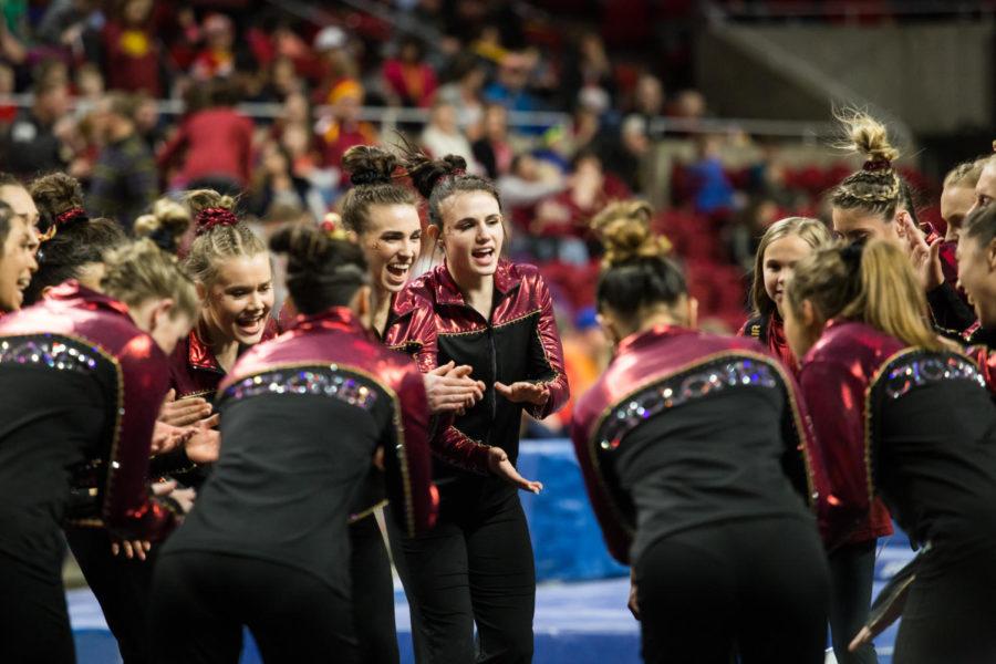 Members of the Iowa State Gymnastics team huddle up before the start of the Quad Meet against Yale, West Virginia and Northern Illinois Feb. 2. The Cyclones won the meet with their highest team score of the season with a total of 196.200 Points.