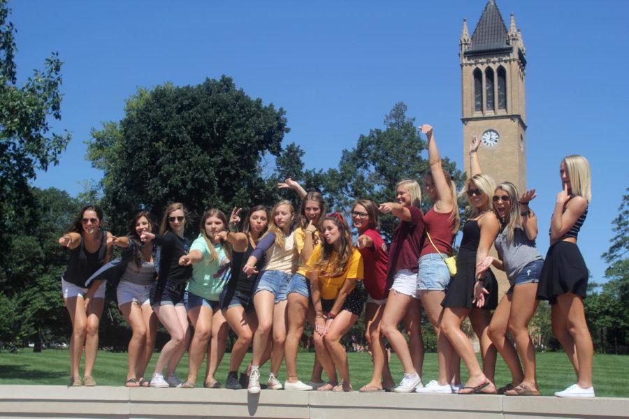 A+group+of+women+pose+for+a+photo+with+their+greek+recruitment+leader%2C+known+as+a+Rho+Gamma%2C+during+bid+day+Aug.+20.%C2%A0
