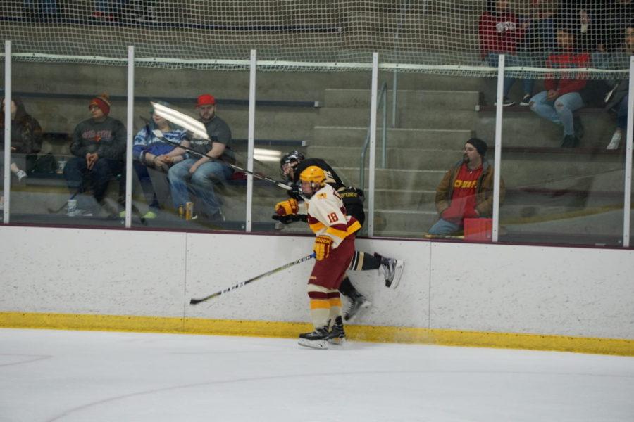 Freshman Dylan Goggin checks a Lindenwood player during the Iowa State VS Lindenwood hockey game on February 3rd. The ending score of this game was 0-2, another loss for the cyclones. 