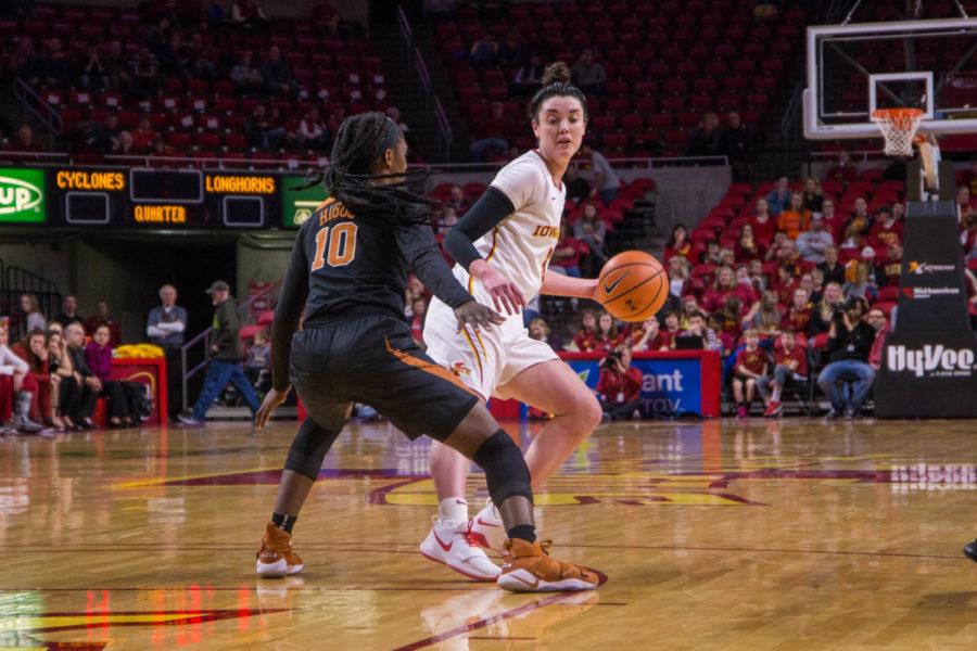 Senior Emily Durr looks for a pass on the court during their game against the Texas Longhorns on Feb. 24 at the Hilton Coliseum. 
