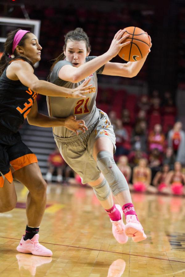 Junior guard Bridget Carleton takes the ball to the hoop during the Iowa State vs OSU basketball game Feb. 10 in Hilton Coliseum.The cyclones were narrowly defeated by the Cowgirls 73-81