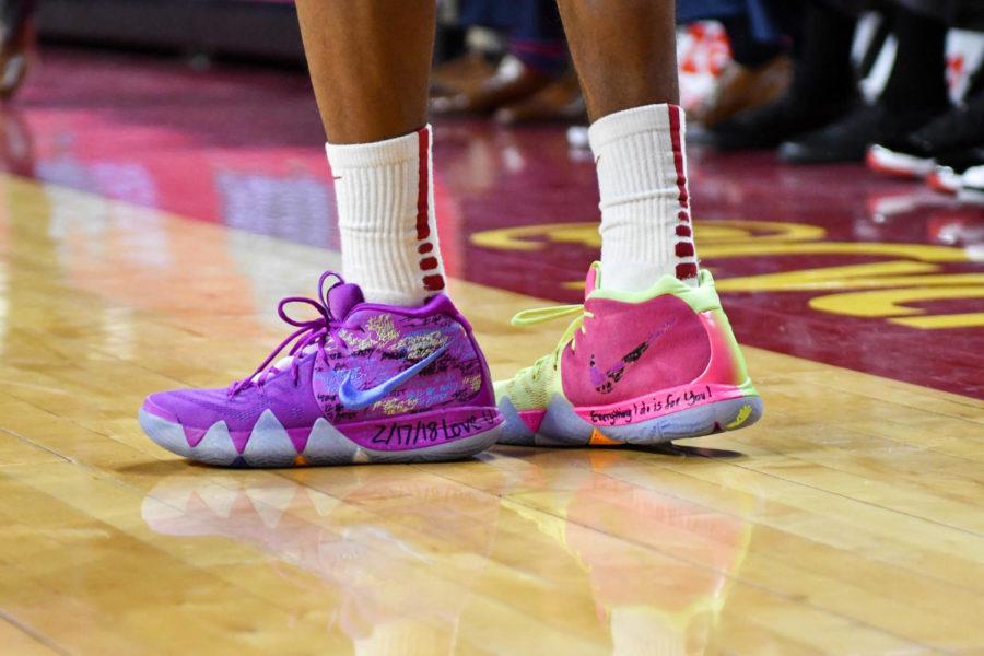 The shoes of senior Donovan Jackson during the game against TCU on Feb. 21. Written on the shoes are phrases of remembrance in honor of his father who recently passed away. 