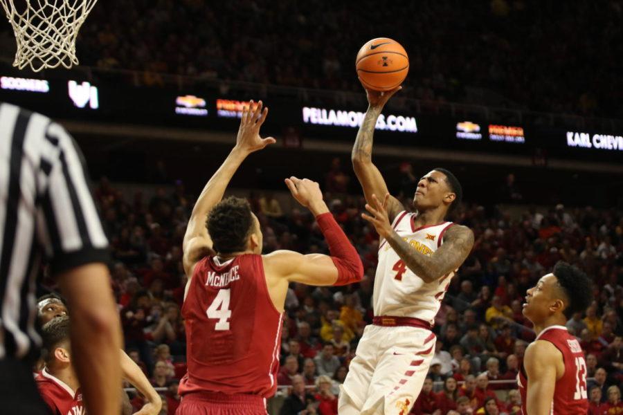 Iowa State senior Donovan Jackson floats the ball up and in during the first half against Oklahoma on Feb. 10.