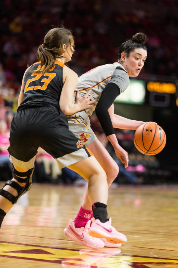 Senior+guard+Emily+Durr+protects+the+ball+during+the+Iowa+State+vs+OSU+basketball+game+Feb.+10+in+Hilton+Coliseum.The+cyclones+were+narrowly+defeated+by+the+Cowgirls+73-81