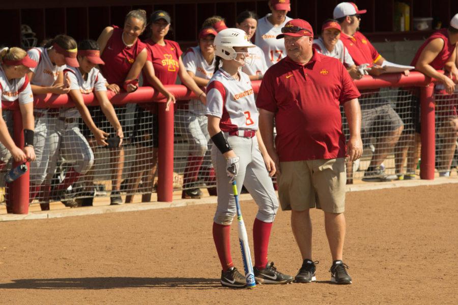 Head Coach Jamie Pinkerton talks to Member of the Iowa State Softball team during the 7th inning Sep. 23. The Cyclones defeated the Kirkwood Eagles 9-1.